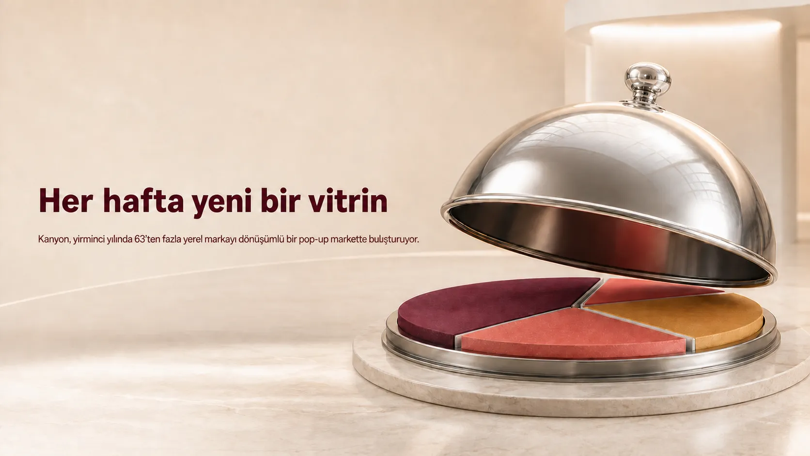 Metal bir açık büfe kubbesinin altında haftalık değişimi simgeleyen renkli döner sergileme platformu